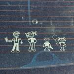 picture of family on car